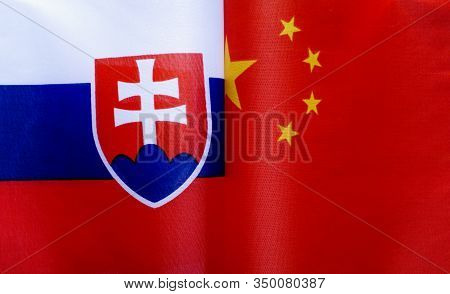 Fragments Of The National Flags Of The Slovak Republic And China In Close-up