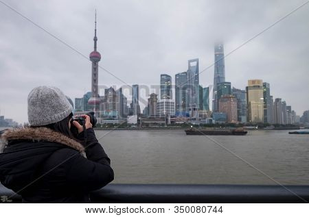 Shanghai, China - January 09 2020: The Unspecific Girl At The Shanghai Waitan 