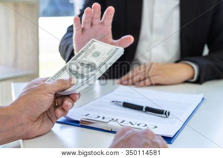 Businessman Refusing Receive Bribe Money In The Envelope Of Their Partner To Give Success The Deal C