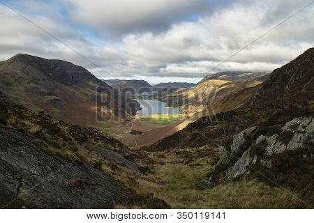 Epic Autumn Fall Landscape Of Buttermere And Crummock Water Surrounded By Mountain Peaks In Lake Dis