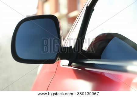 Side Rear View Mirror Of Modern Car Outdoors