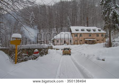The Car Rides On A Snowy Mountain Road. The Village Of Lumshory, Zakarpattia Region, Ukraine. Februa