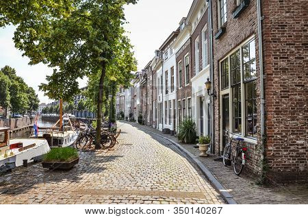 Hertogenbosch, North Brabant, Netherlands - June 9, 2018: Street Along The Water Canal With Boats In