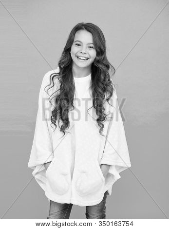 Little Girl With Long Hair. Happy Childhood. Feeling Comfy. Adorable Child On Turquoise Background. 