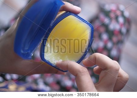 Top View Of Young Women Use Vaseline For Caring Health