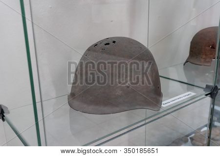 Sukhoy Log, Russia - June 26, 2019: Holey Helmet Of A Soviet Soldier. Title 