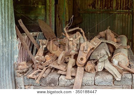Old Rusted Machine Implements Which Would Have Been Used By Early Settler Farmers Of Yesteryear