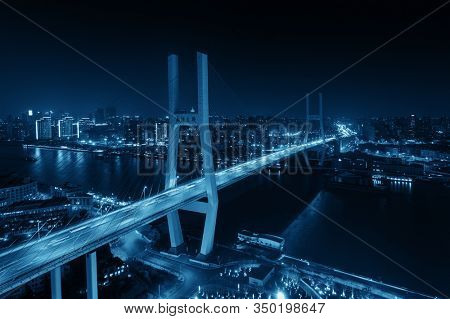 Shanghai Nanpu Bridge over Huangpu River with busy traffic in China.