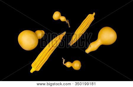 Yellow Okra And Bottle Shaped Chinese Gourds Hu Lu On Black Background. Abstract Composition