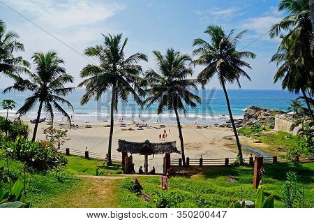 Sandy beach on a sunny day near city Kovalam in Kerala, India