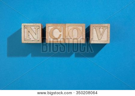 wood block with text ncov-2019 noval coronavirus