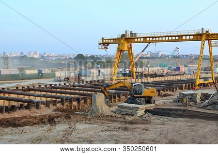 Excavator Working At Construction Of A New Metro Line. Contractor Digding The Tunnel Subway And Rail
