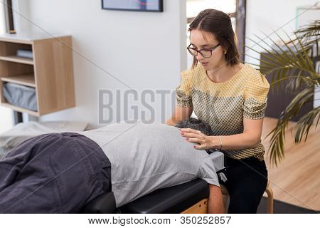 Man Having Chiropractic Back Adjustment. Physioterapy, Osteopathy, Alternative Medicine Pain Relief 