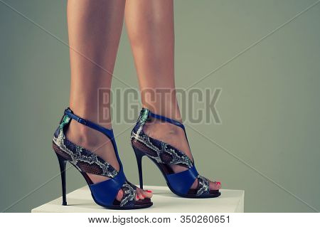Beautiful Female Feet In Stylish Blue High-heeled Sandals.