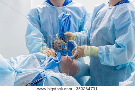 Arthroscope Surgery. Orthopedic Surgeons In Teamwork In The Operating Room