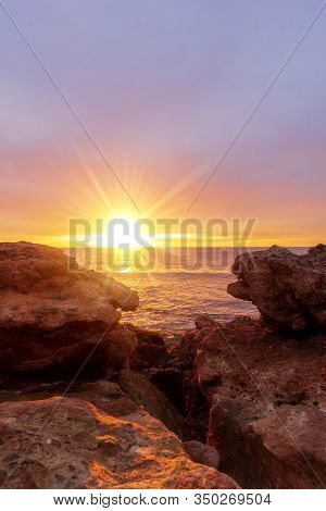 The Sunrise Sun Between The Rocks Of Oropesa
