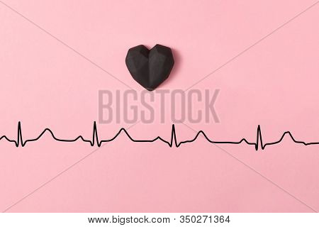 Holiday composition with gypsum hearts above line of love echocardiogram on a pastel pink background, copy space. Valentine's day greeting card.