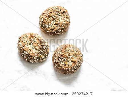 Multigrain Multiseed Fitness Buns On Light Background, Top View. Copy Space
