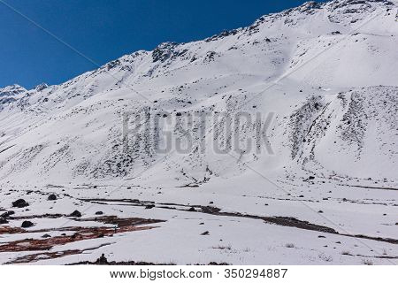 Natural Monument El Morado. An Snowy Valley Among The Mountains In Cajón Del Maipo, Central Andes Of