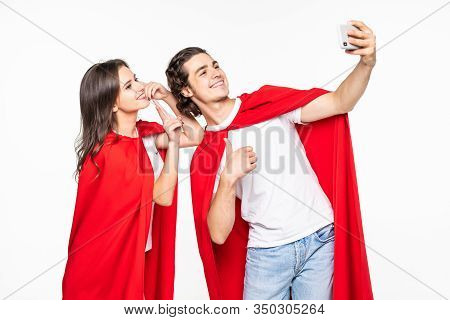 Young Couple Hero In Red Cout Take Selfie On The Phone Isolated On White Background