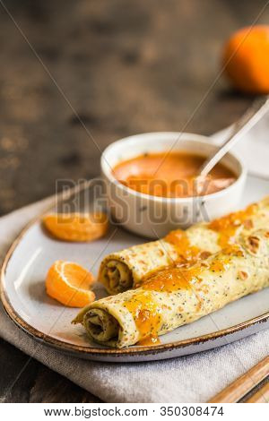 Poppy Seed Crepes (blinis). Pancakes With Poppy Seeds And Tangerine Jam