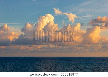View Of The Sun Setting Over The Horizon Of The Sea, Ocean. Beautiful Sunset Sea. Sea Sunset Backgro