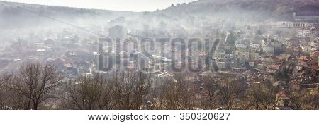 Early Morning Mist Rolling Down From The Hills On To The Rural Landscape Of Veliko Tarnovo, In Bulga