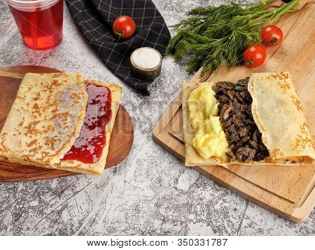 Shrovetide Maslenitsa. Traditional Festival Meal. Pancakes Blini With Meat And Berry Jam, Flat Lay B