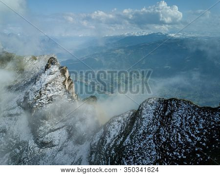 Snowy alpine peaks aerial by Wallensee, Switzerland
