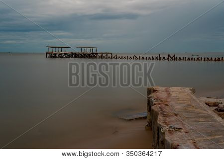 Dilapidated Old Fishing Dock Collapsing Into The Sea In Pak Nam Pran On The Gulf Of Thailand In Thai
