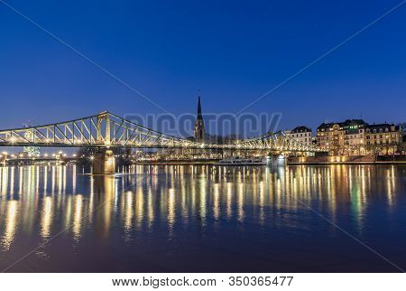 Old Iron Footbridge Called Eiserner Steg In Frankfurt Spanning River Main By Night In Frankfurt, Ger