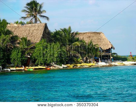 Thatched Roof Huts On The Beach