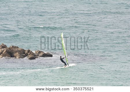 Windsurfing On The Background Of The Sea