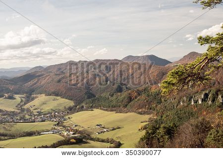 Sulov-hradna Village With Partly Rocky Hills Of Sulovske Vrchy Mountains Covered By Colorful Forest 