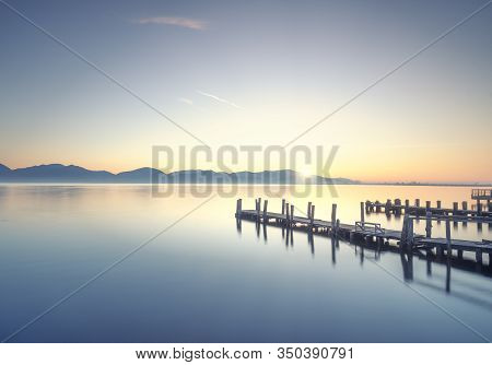 Two Wooden Piers Or Jetties And Lake At Sunrise. Torre Del Lago Puccini, Versilia, Massaciuccoli Lak