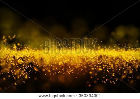 Glow Golden Particles On Black Background