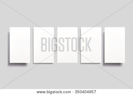 Blank Paper Cards Soaring In The Air Isolated On Grey. Can Be Used For Social Media Stories, Promoti