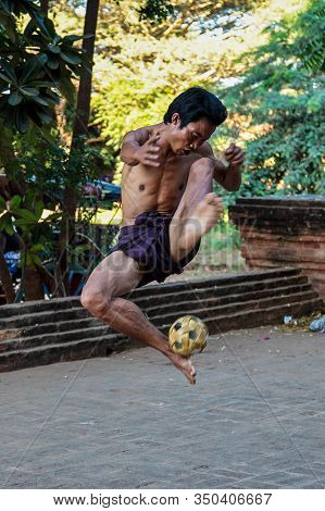 Bagan, Myanmar - Nov 15, 2019: Burmese Men Playing The Traditional Ball Game Of Myanmar: Chinlone.