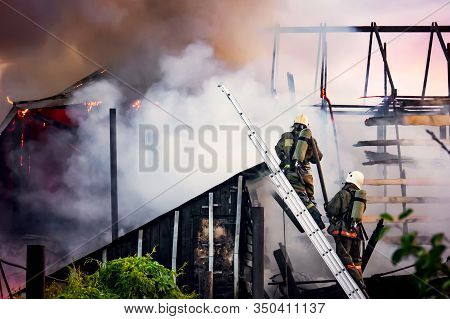 Firefighters Battle A Wildfire Against A Background Of Thick White Smoke.. Firefighters On The Stair