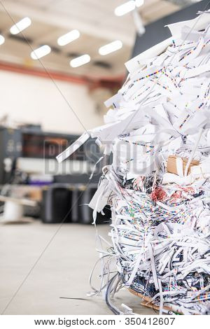 Close-up of cut papers heap produced with linotype machine at printing house