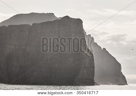 Faroe Islands Sunset Dramatic Coastline Landscape . Vagar Island. Seascape