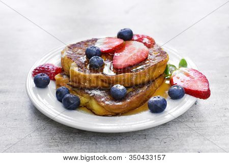 Delicious French Toast With Fresh Fruits And Maple Sirup. Tasty Breakfast Scene Or Dessert With Toas