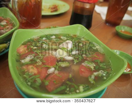 Close Up Of Beef Soup In Green Bowl, Ready To Eat