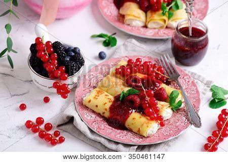 Crepes With Lemon Cream And Raspberry Jam..selective Focus. Style Vintage