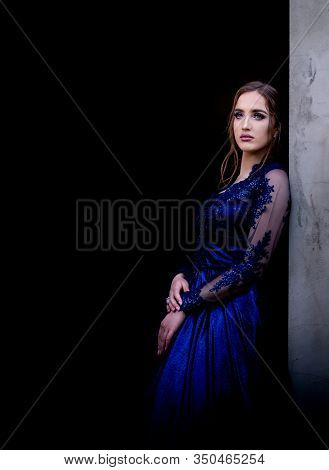 Close Up Portrait Of Beautiful Teen Girl In Beautiful Ultramarine Prom Dress Prom Dress. Black Backg