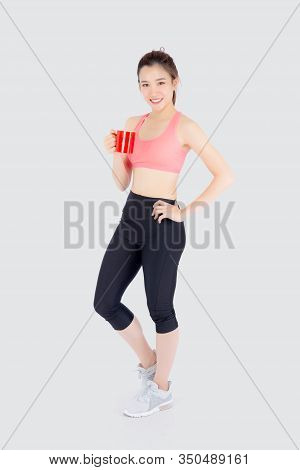 Beautiful Young Asian Woman In Sport After Workout Drinking Water From Glass For Thirsty Isolated On