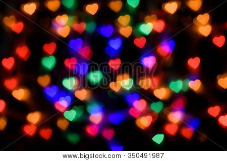 Multicolored Lights In The Form Of A Serced On A Black Background