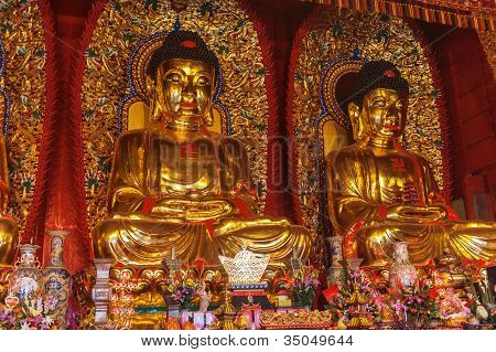 Baolin Temple Seated Statues Of Buddha. It Is Located 25 Km Southeast Of Shaoguan, China In The Town