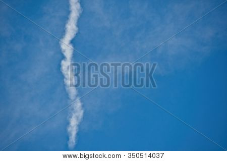 Dissapearing Plane Trail On Almost Clear Blue Sky