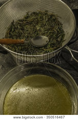 Making Of Marijuana Butter With Leafs And Yellow Butter Which Will Be Green
